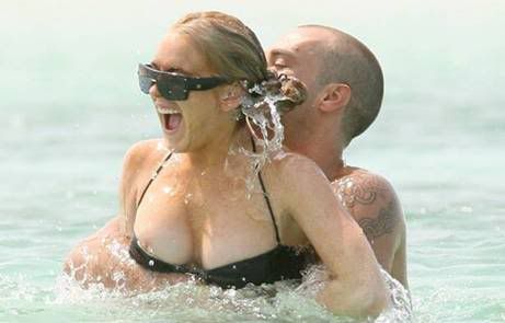 Lindsay Lohan and her breasts spent the week frolicking and splashing their 